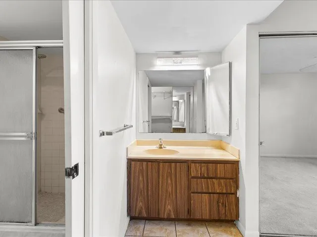a bathroom with a sink and a mirror