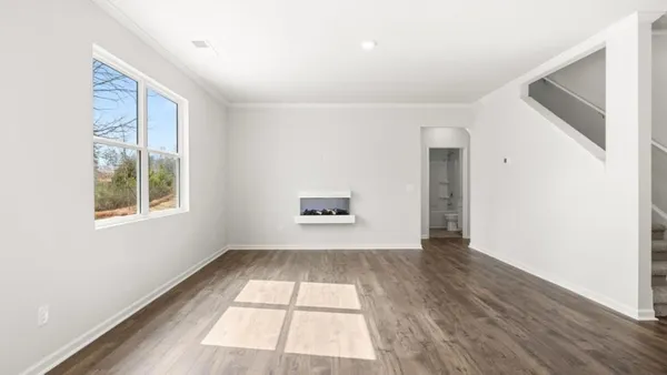 a view of an empty room with a window