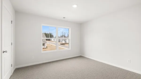 a view of a room that has a window in it