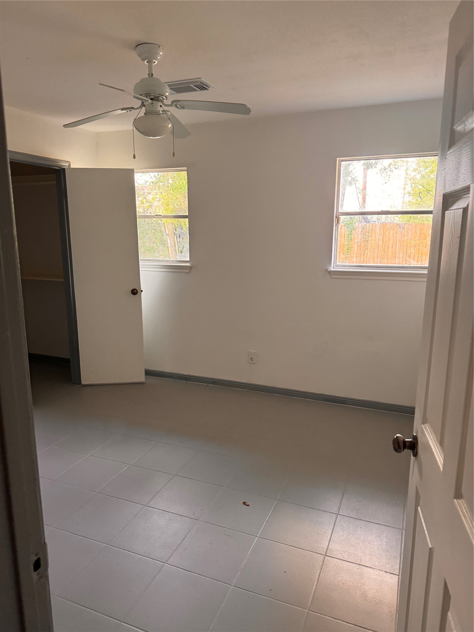 604 Briarclift Lane Baytown, TX 77521 - Photo 11 of 12 a view of an empty room with a window