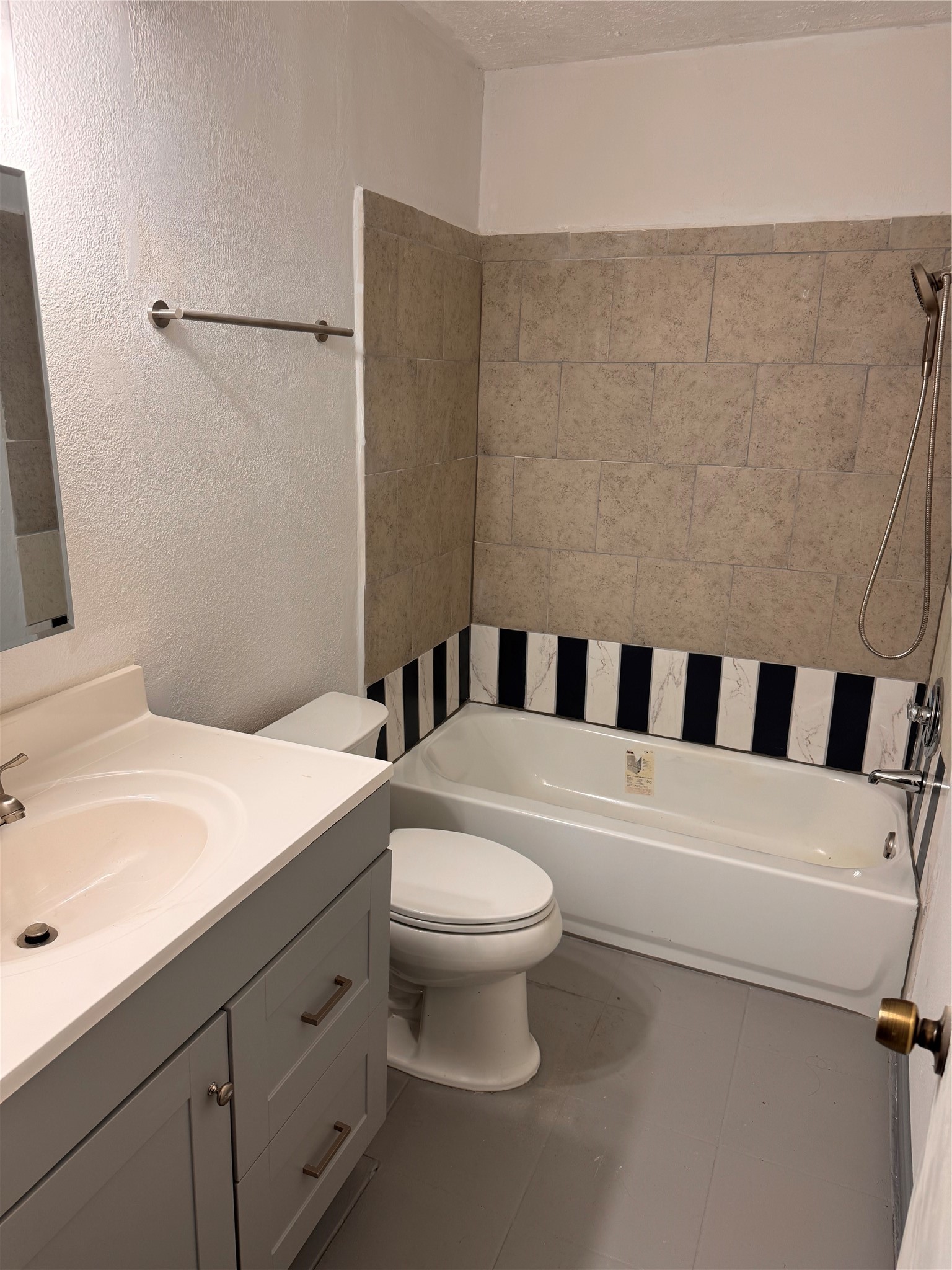 604 Briarclift Lane Baytown, TX 77521 - Photo 10 of 12 a bathroom with a sink a toilet and a mirror