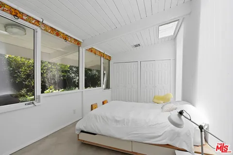 a bathroom with a tub and window