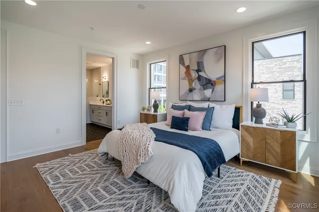 a bedroom with a large bed and a window