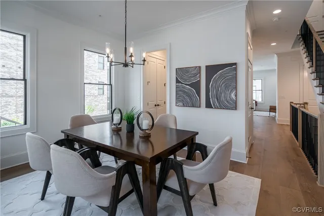 a view of a dining room with furniture and window