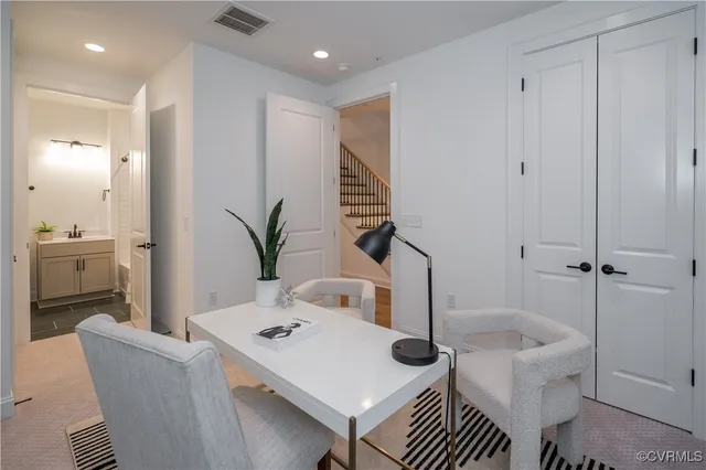 a workspace with furniture and window