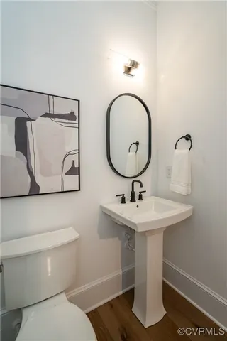 a kitchen with stainless steel appliances a sink a stove a refrigerator and cabinets