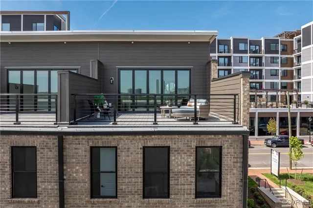 a group of people sitting in front of a building