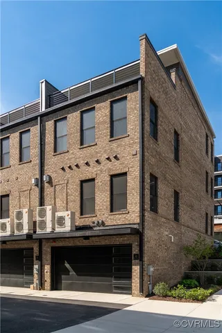 a front view of a building with many windows