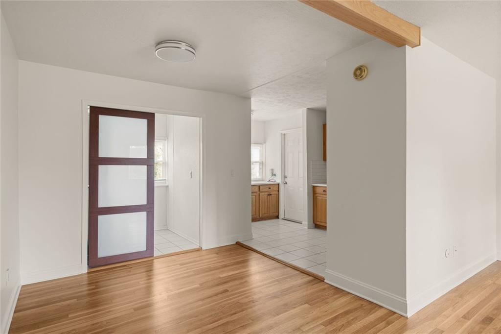 2941 Caldwell Road Northeast, Unit B4 Brookhaven, GA 30319 - Photo 13 of 51 an empty room with wooden floor and entrance