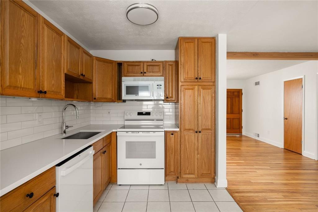 2941 Caldwell Road Northeast, Unit B4 Brookhaven, GA 30319 - Photo 17 of 51 a kitchen with stainless steel appliances granite countertop a sink a stove a refrigerator and cabinets
