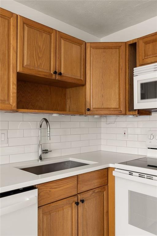 2941 Caldwell Road Northeast, Unit B4 Brookhaven, GA 30319 - Photo 18 of 51 a kitchen with stainless steel appliances granite countertop a sink a stove microwave and cabinets