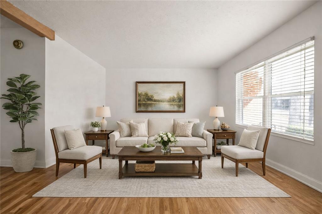 2941 Caldwell Road Northeast, Unit B4 Brookhaven, GA 30319 - Photo 2 of 51 a living room with furniture and a potted plant