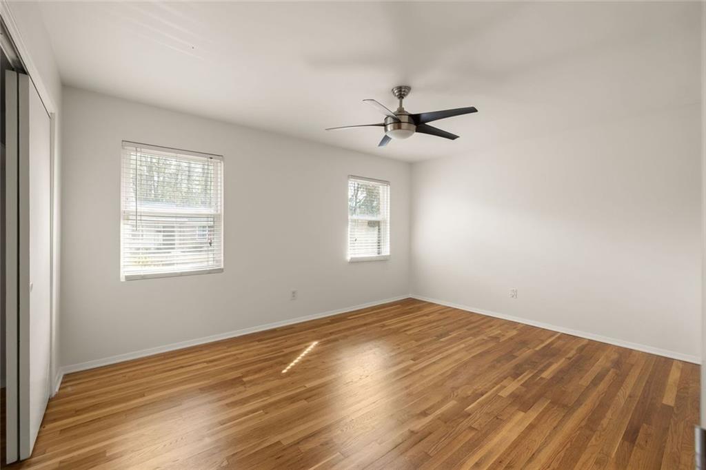 2941 Caldwell Road Northeast, Unit B4 Brookhaven, GA 30319 - Photo 23 of 51 a view of empty room with wooden floor and fan