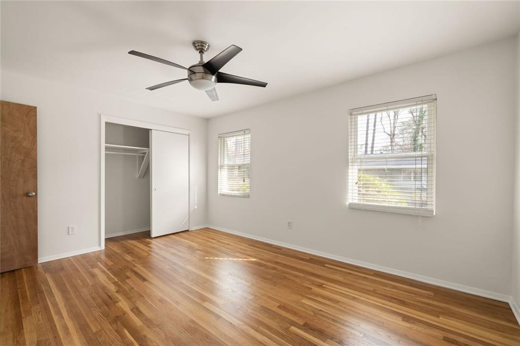 2941 Caldwell Road Northeast, Unit B4 Brookhaven, GA 30319 - Photo 24 of 51 a view of empty room with wooden floor and fan