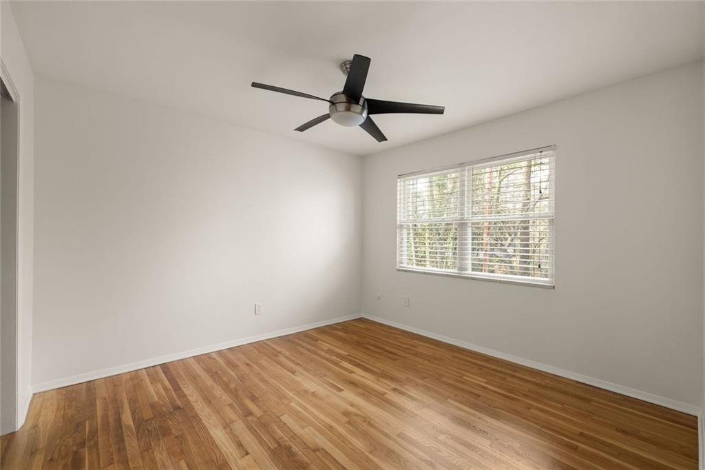 2941 Caldwell Road Northeast, Unit B4 Brookhaven, GA 30319 - Photo 26 of 51 a view of empty room with wooden floor and fan