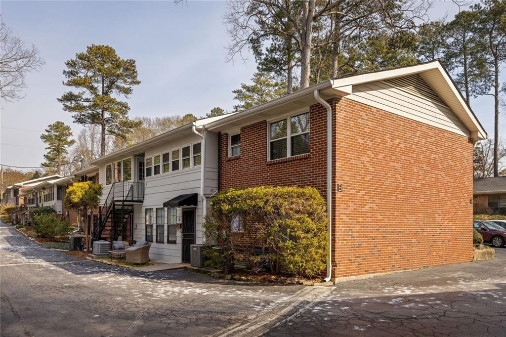 2941 Caldwell Road Northeast, Unit B4 Brookhaven, GA 30319 - Photo 30 of 51 a front view of a house with a tree