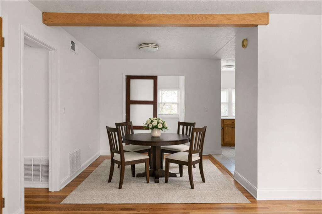 2941 Caldwell Road Northeast, Unit B4 Brookhaven, GA 30319 - Photo 3 of 51 a view of a dining room with furniture and wooden floor