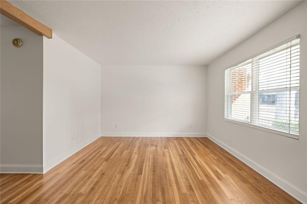 2941 Caldwell Road Northeast, Unit B4 Brookhaven, GA 30319 - Photo 8 of 51 a view of a room with wooden floor and window