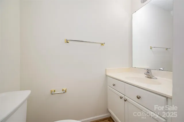 a bathroom with a sink and mirror