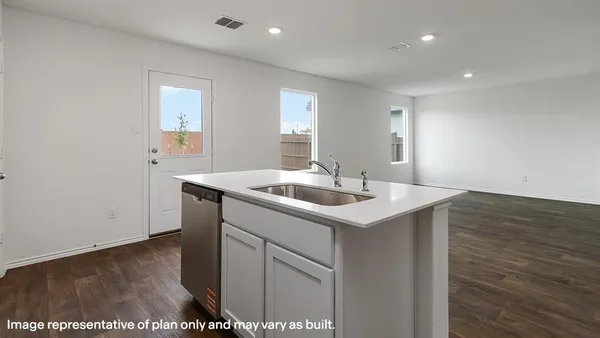 a view of kitchen with microwave and cabinets