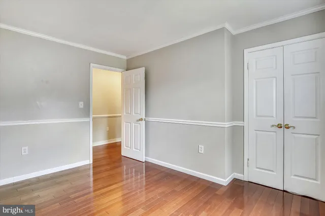 an empty room with wooden floor