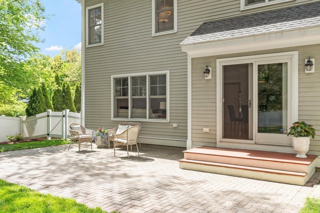 56 Old Marlboro Road Concord, MA 01742 - Photo 26 of 34 a front view of a house with a patio