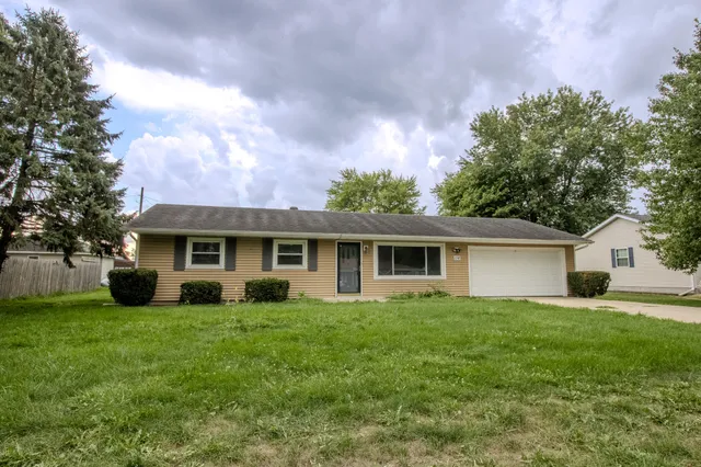 a house that has tree in front of it
