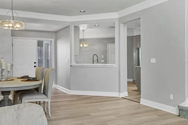 a kitchen with a sink dishwasher stove and cabinets