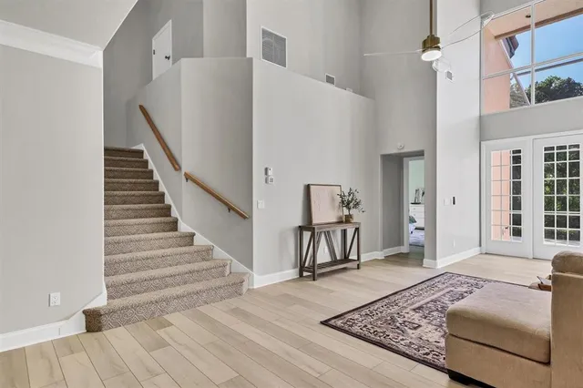 a bathroom with a toilet a sink and a large mirror