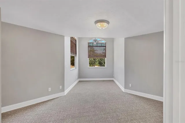 a view of outdoor space with wooden floor and window