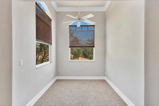 a view of a room with a window and wooden floor
