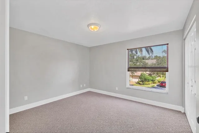 a dining room with furniture window and outside view