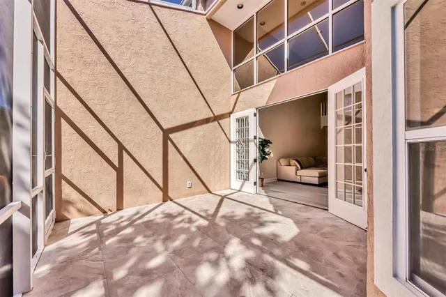 a view of a pathway both side of grassy field with trees