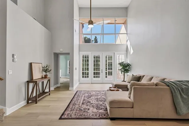 a bedroom with a bed couch and a window