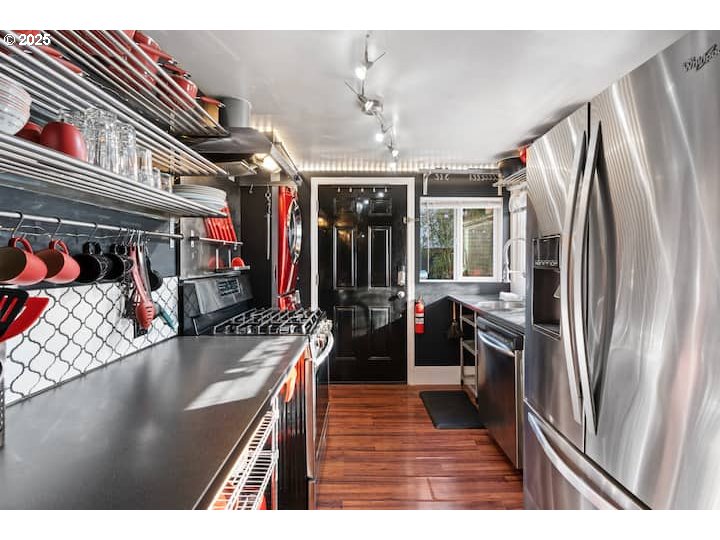 610 West Fourth Plain Boulevard Vancouver, WA 98660 - Photo 11 of 41 a kitchen with stainless steel appliances granite countertop a refrigerator a stove and a sink