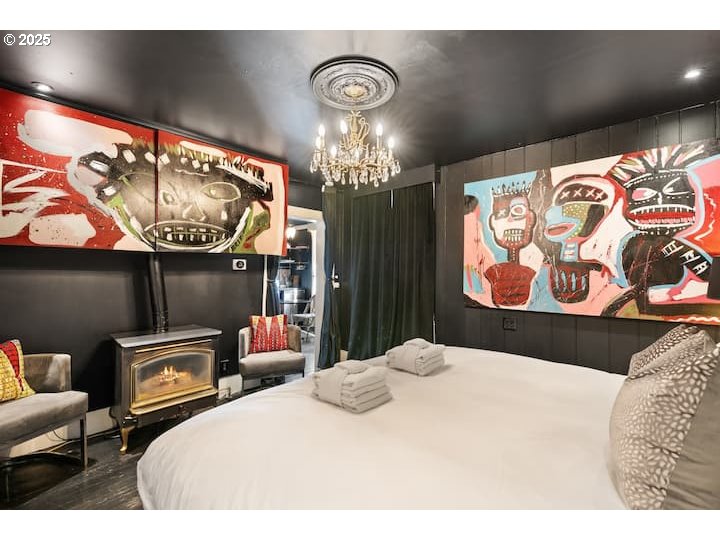 610 West Fourth Plain Boulevard Vancouver, WA 98660 - Photo 30 of 41 a bedroom with a bed and a painting on the wall