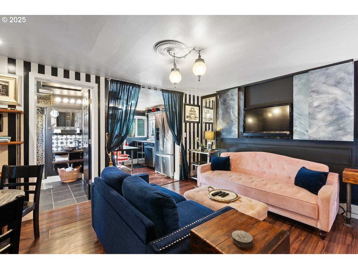 610 West Fourth Plain Boulevard Vancouver, WA 98660 - Photo 3 of 41 a living room with furniture and a flat screen tv