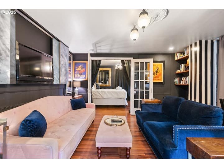 610 West Fourth Plain Boulevard Vancouver, WA 98660 - Photo 5 of 41 a living room with furniture and a flat screen tv