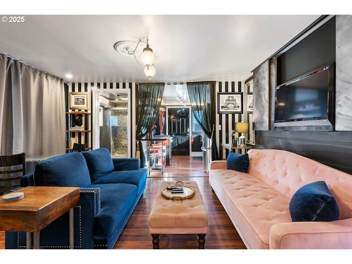 610 West Fourth Plain Boulevard Vancouver, WA 98660 - Photo 8 of 41 a living room with furniture and a flat screen tv
