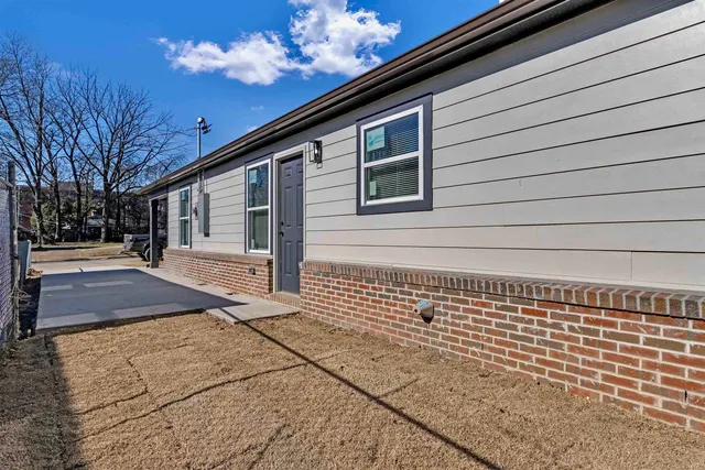 a view of a house with a street