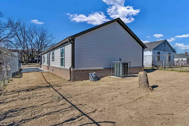 a view of house with yard