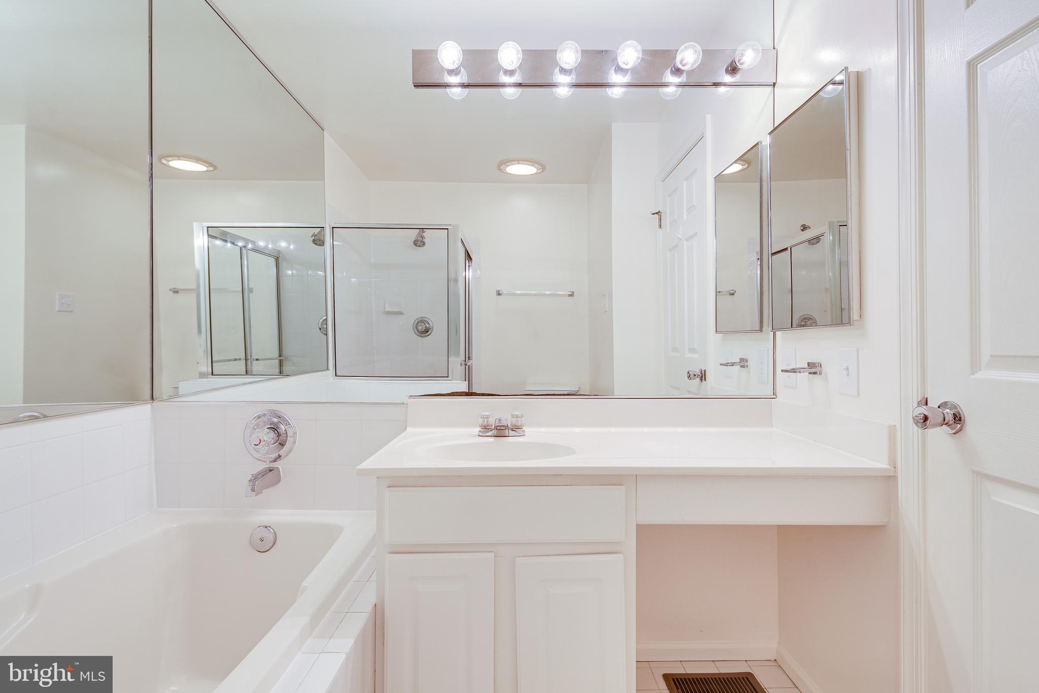 6307 Wind Rider Way Columbia, MD 21045 - Photo 19 of 33 Upper Level -Primary Bath w/ Soaking Tub & Vanity