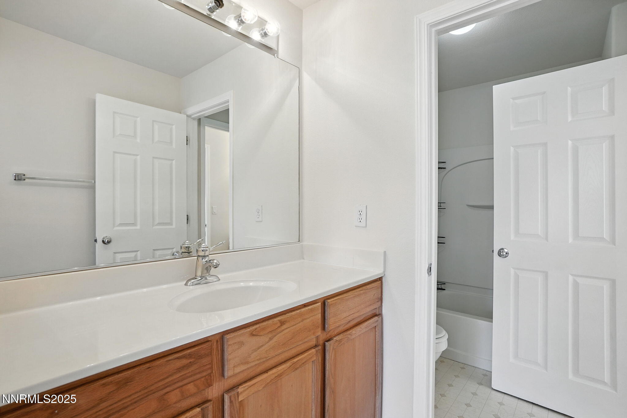 9248 Running Dog Circle Reno, NV 89506 - Photo 11 of 20 a bathroom with a sink and a mirror