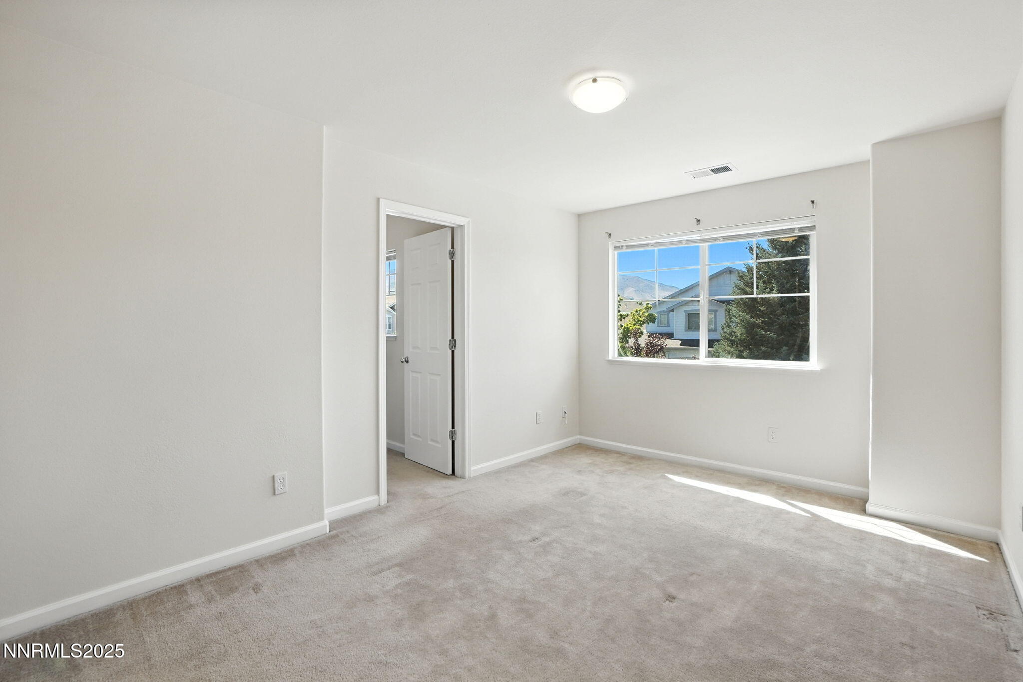9248 Running Dog Circle Reno, NV 89506 - Photo 14 of 20 an empty room with windows and closet