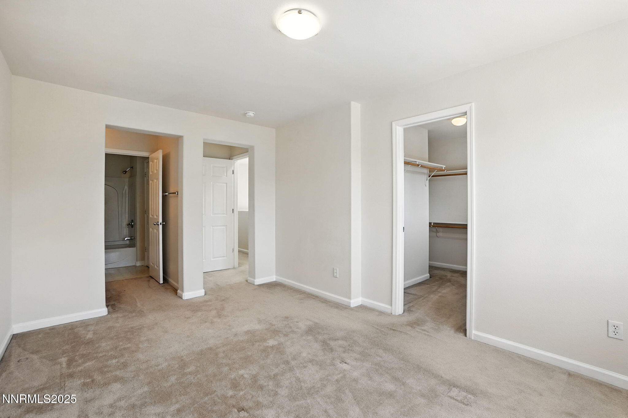 9248 Running Dog Circle Reno, NV 89506 - Photo 16 of 20 an empty room with closet and a bathroom