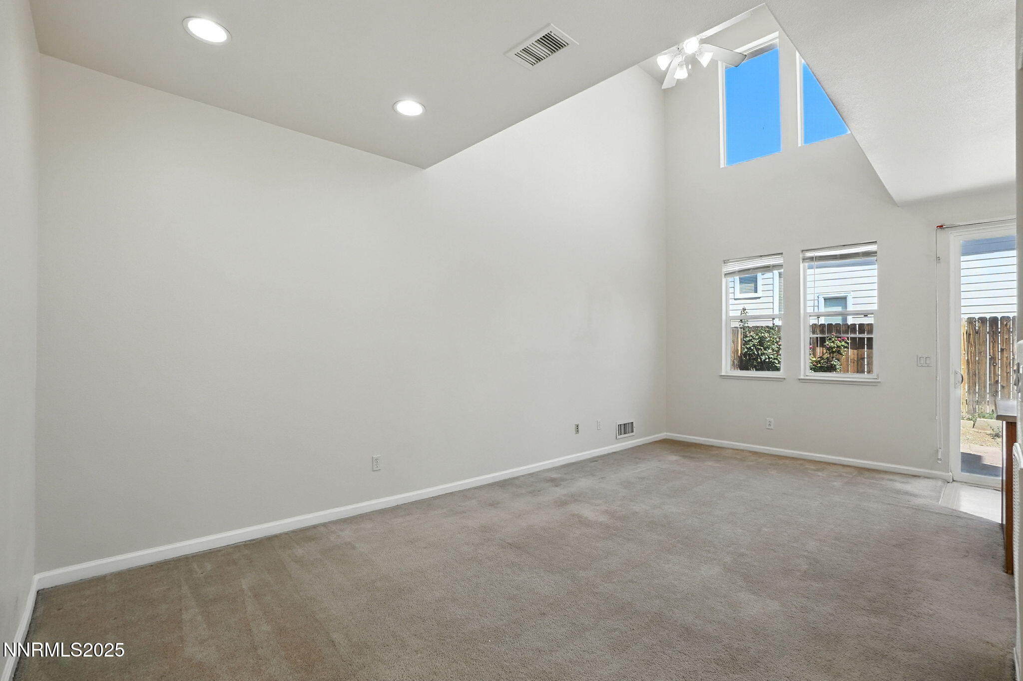 9248 Running Dog Circle Reno, NV 89506 - Photo 3 of 20 an empty room with windows
