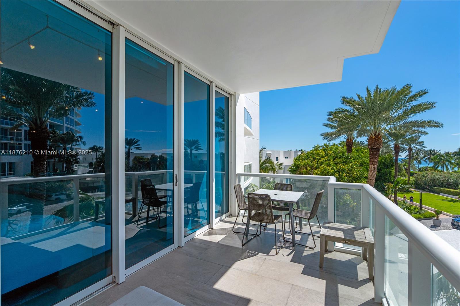50 South Pointe Drive, Unit 606 Miami Beach, FL 33139 - Photo 5 of 36 a view of chair and tables in the balcony