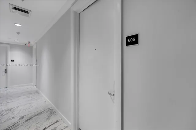 a view of a hallway with shower