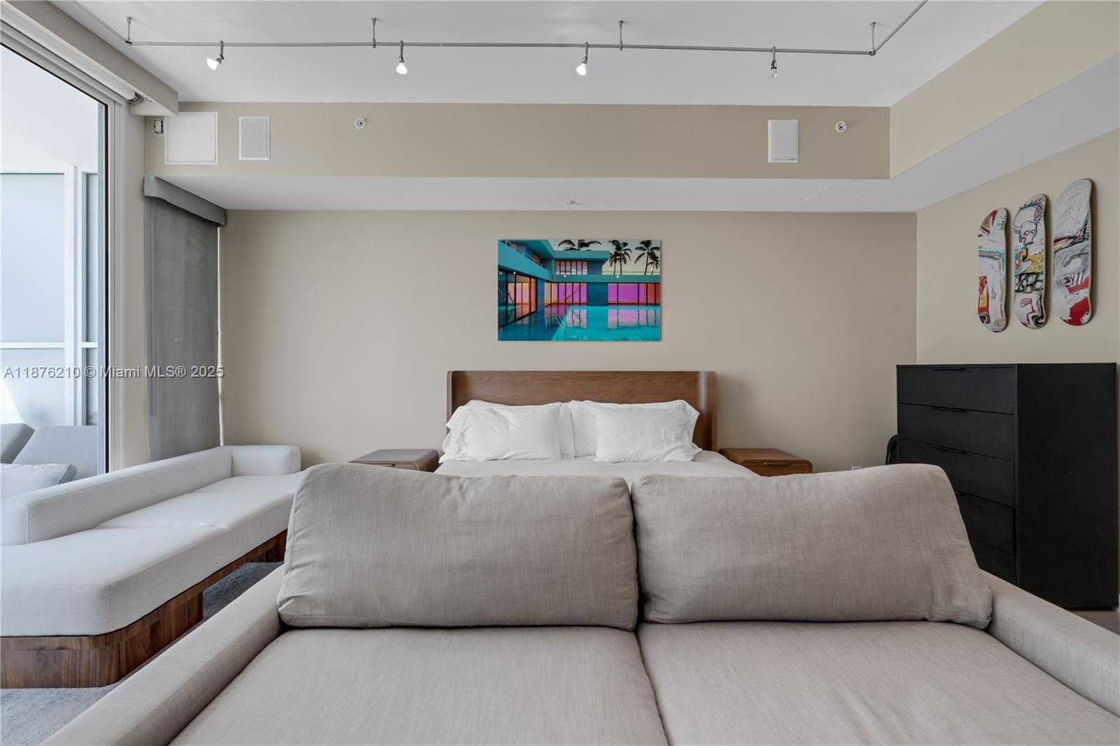 50 South Pointe Drive, Unit 606 Miami Beach, FL 33139 - Photo 10 of 36 a bedroom with a bed and a couch