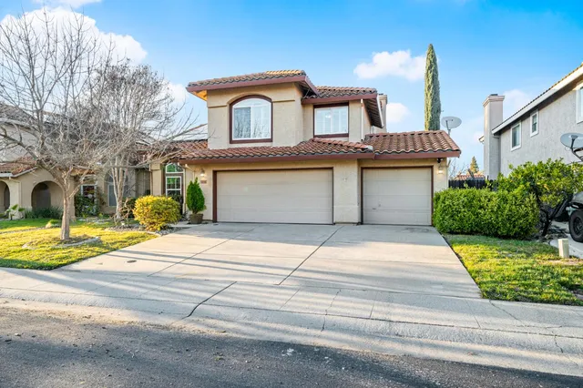 a view of an entryway with wooden floor and door